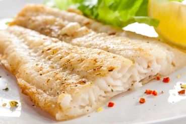 Fischfilet auf Oregano-Tomaten-Gemüse